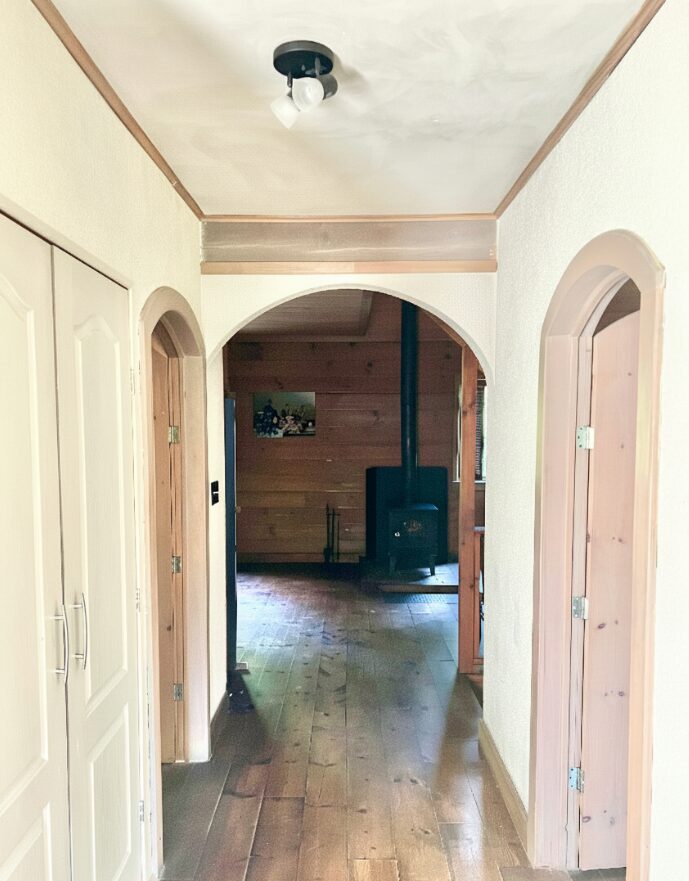 Hallway with arches and wood stove